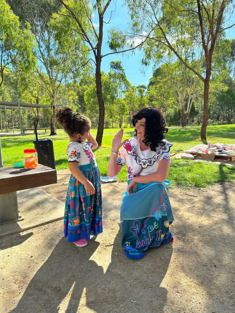 Children's entertainers Sydney giving a child a hi five. MIrabel children's entertainer. 