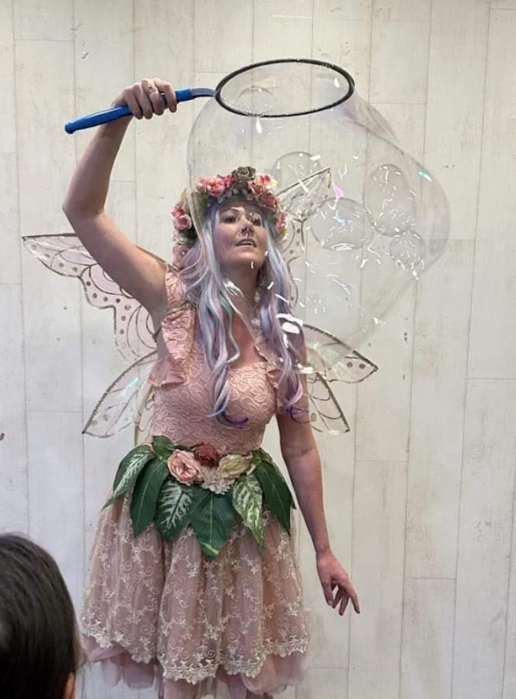 fairy entertainer performing giant bubble shows. 