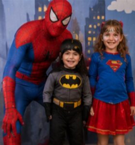Spiderman entertainer with kids at a party