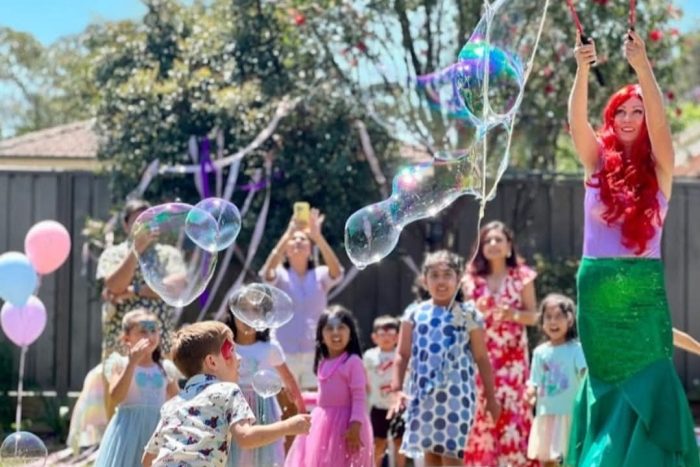 Giant bubble party entertainment for children in Sydney featuring a mermaid entertainer.