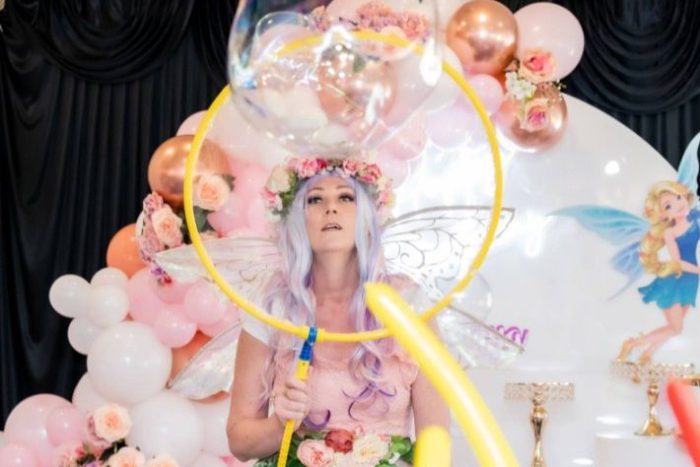 Fairy entertainer performing a giant bubble show at a children's party in Sydney